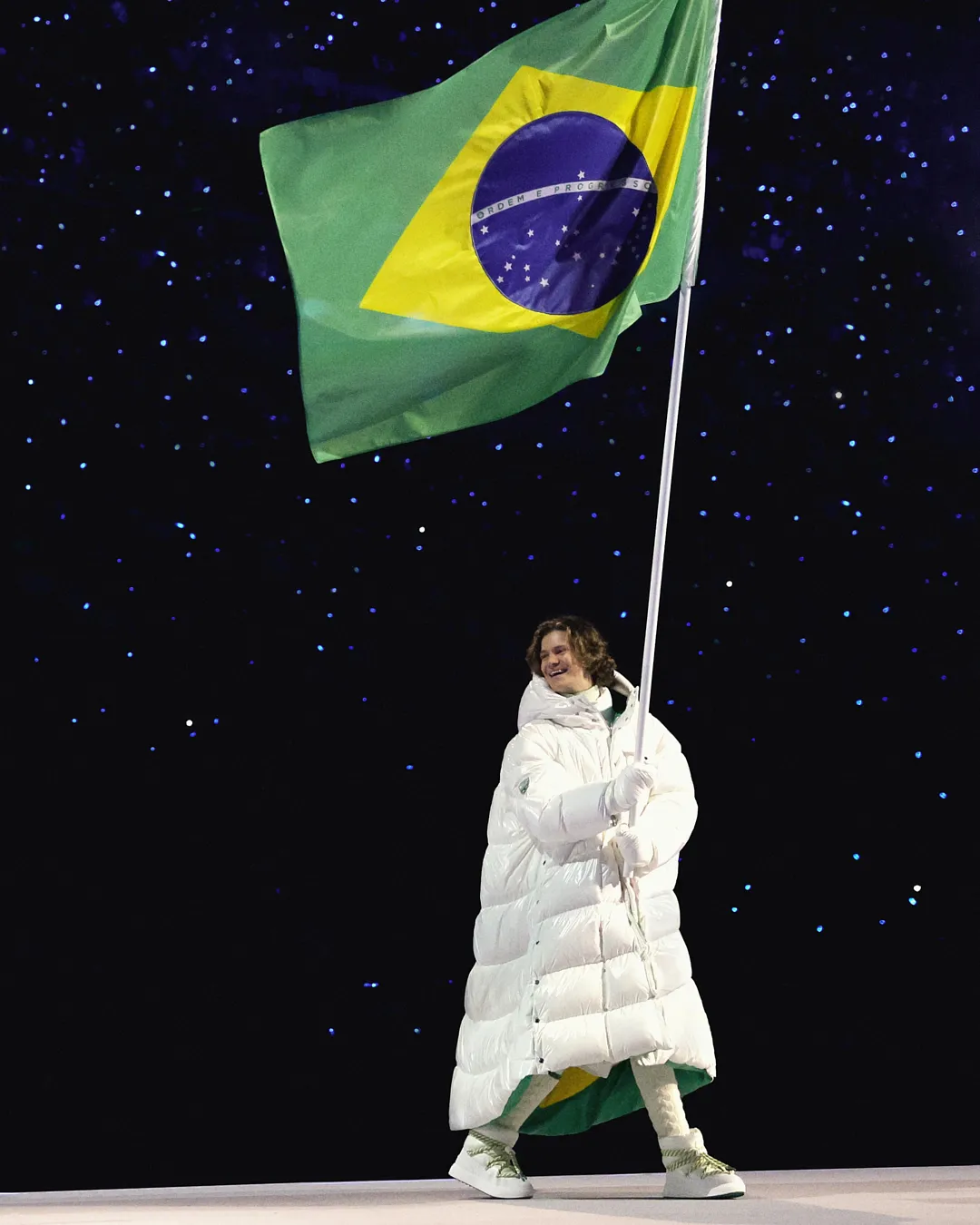 Image may contain Flag Adult Person Clothing Glove Brazil Flag Footwear and Shoe