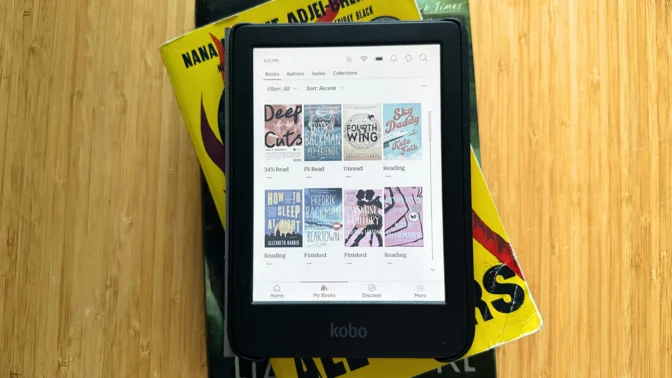 A Kobo Clara Colour on a stack of books