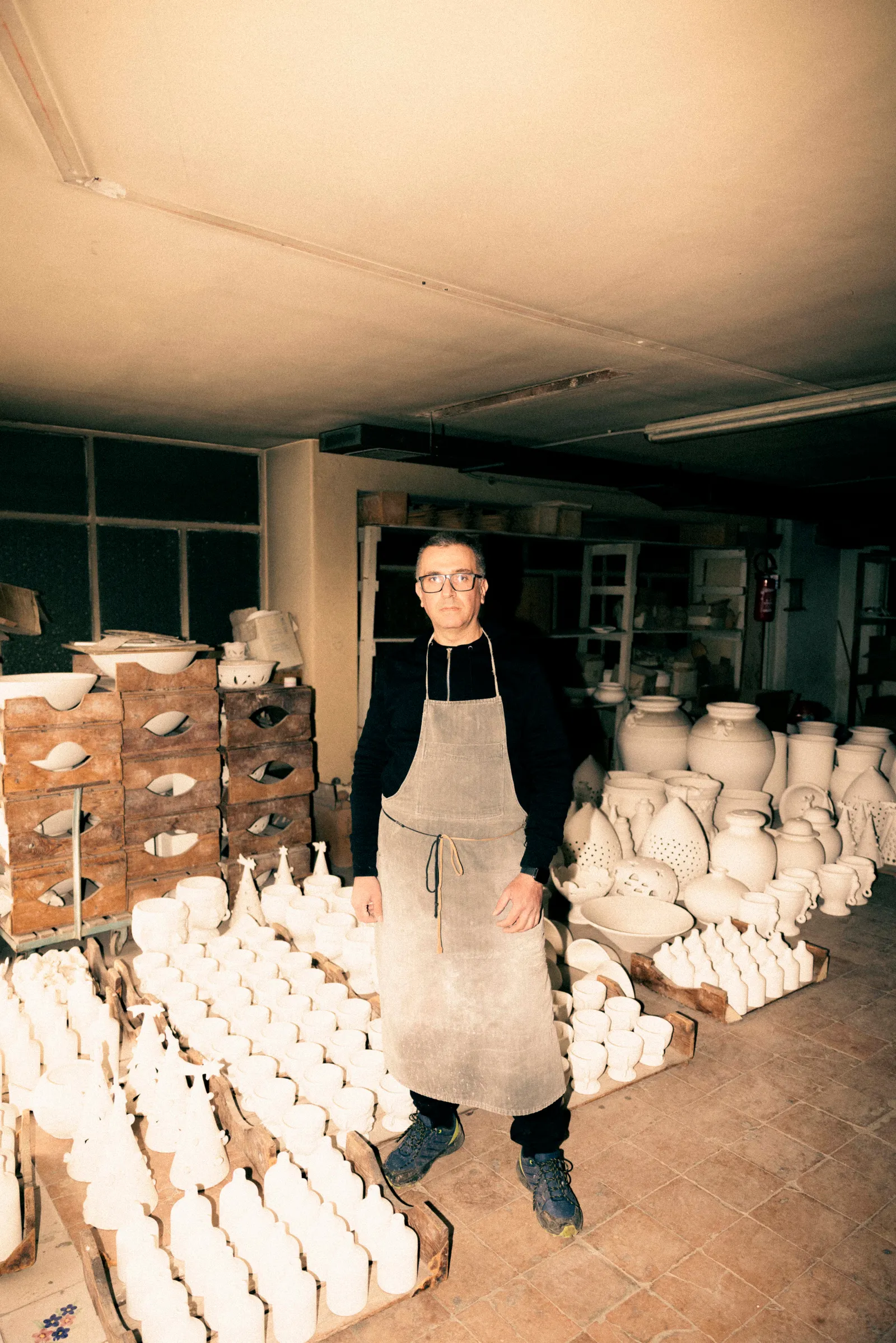 Image may contain Pottery Adult Person Cookware Pot Face and Head