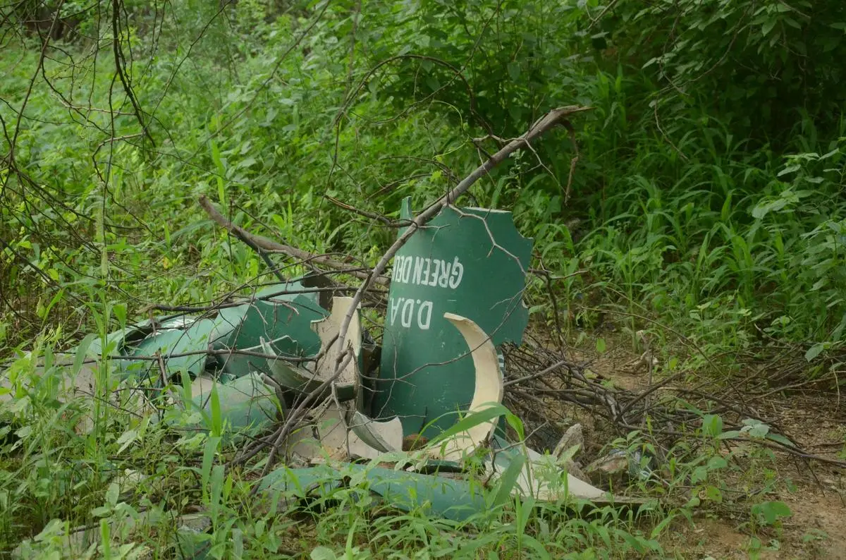 Waste dumped inside the forest. Waste dumped inside the forest.