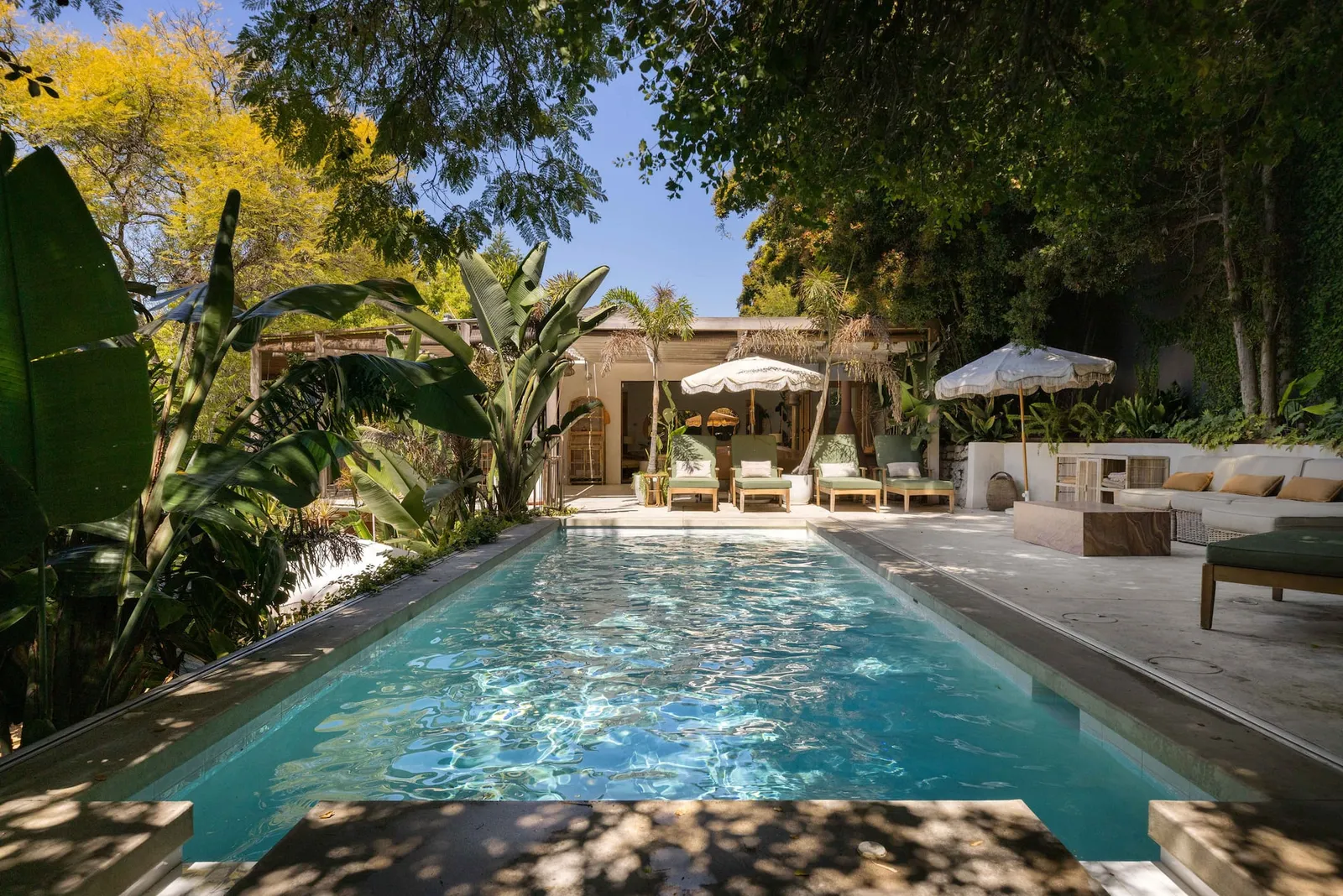 Image may contain Architecture Building House Housing Villa Pool Water Swimming Pool Chair Furniture and Hotel