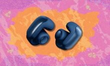 bose ultra open-ear earbuds against a pink and orange patterned background