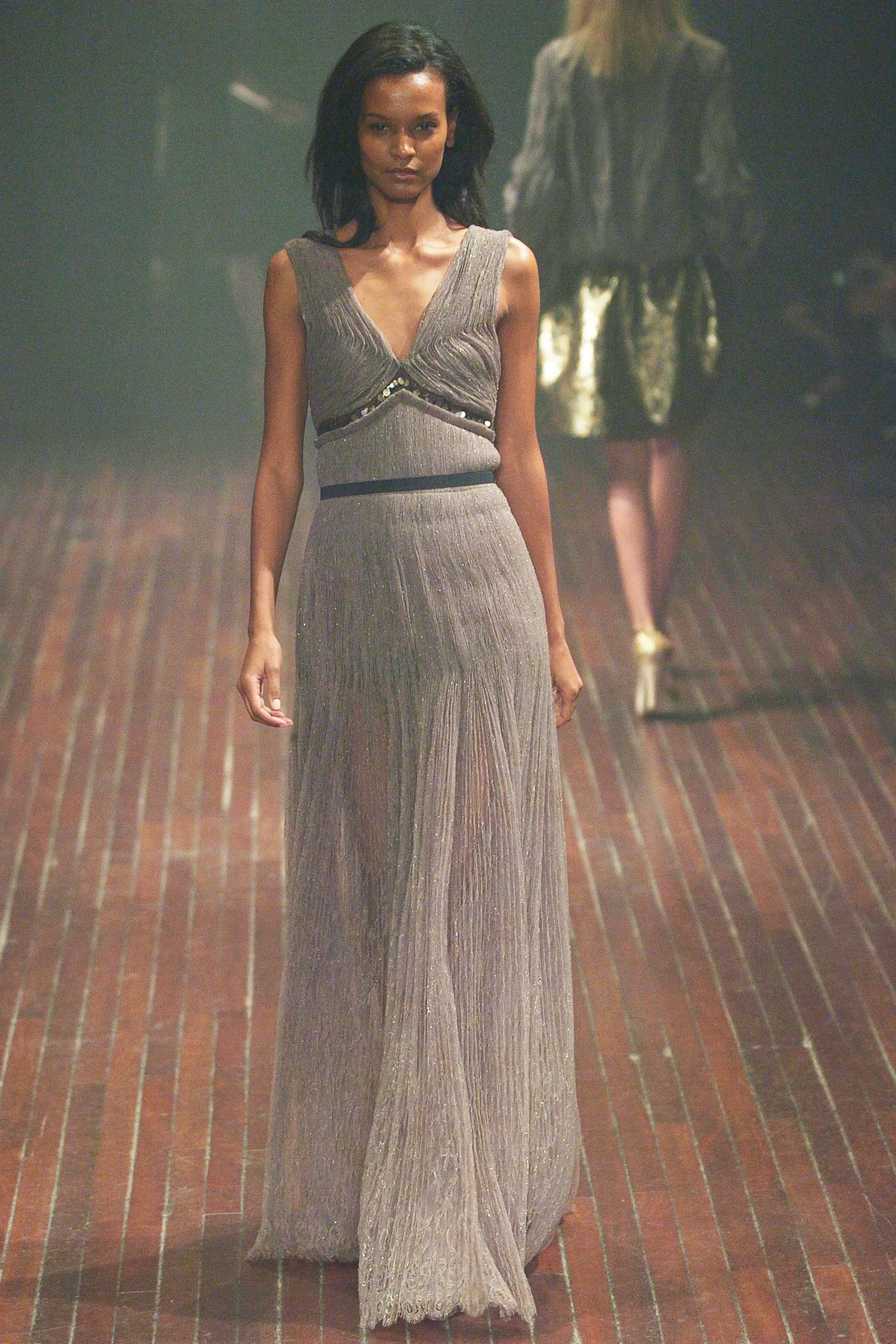 Image may contain Liya Kebede Clothing Dress Fashion Formal Wear Evening Dress Adult Person Gown and Footwear