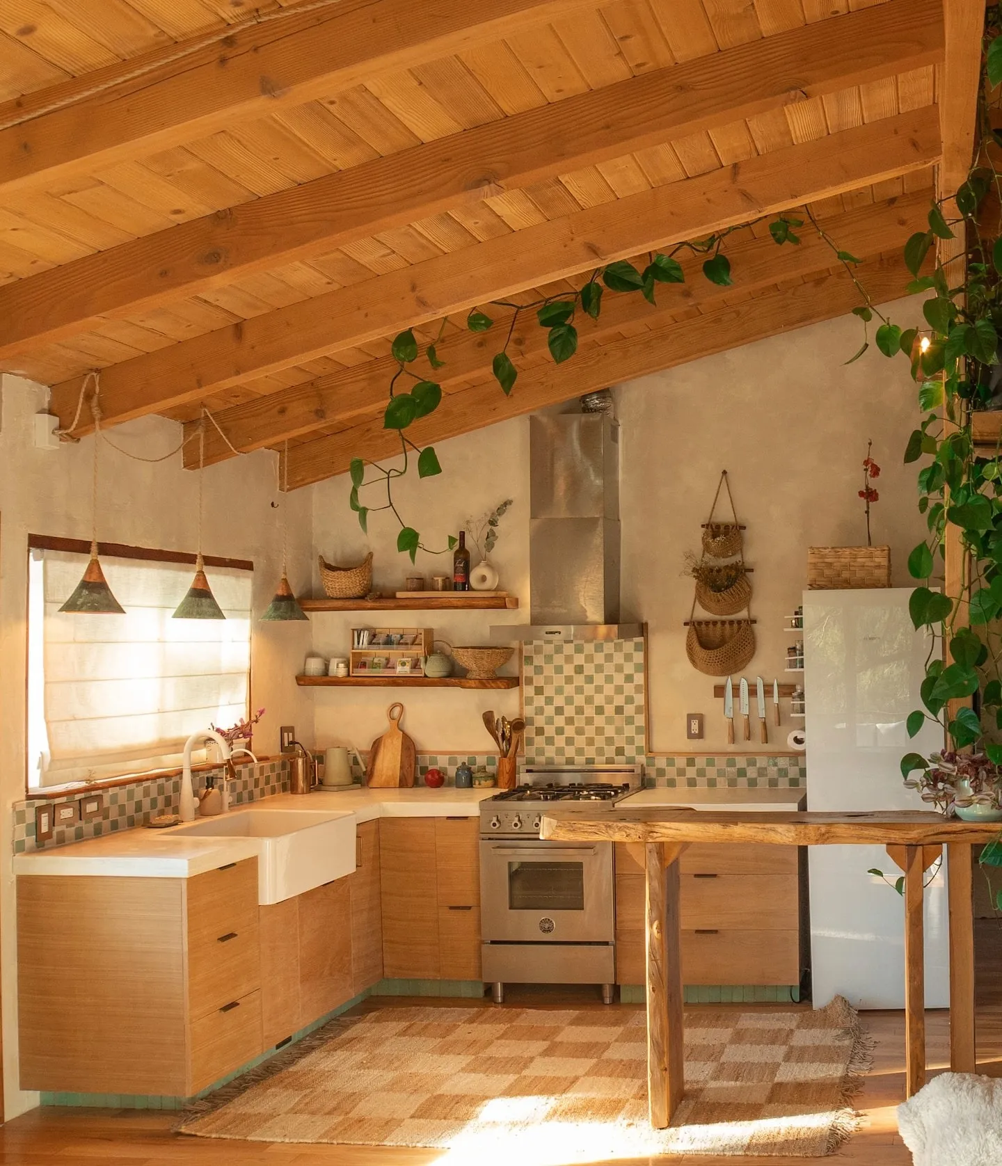 Image may contain Indoors Interior Design Wood Kitchen Hardwood Stained Wood Sink and Lamp