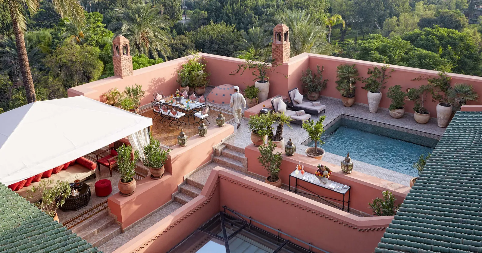 Image may contain Architecture Building House Housing Villa Plant Person Terrace Outdoors Pool Water and Chair