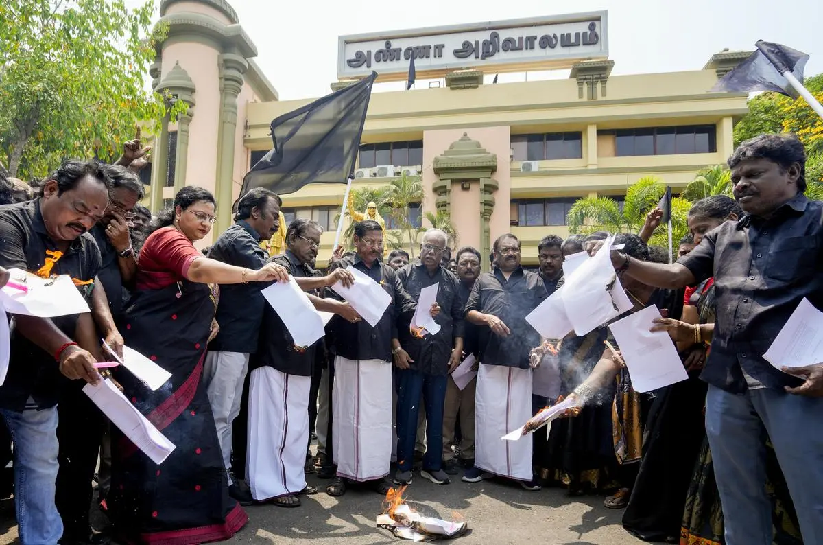 Supporters of the DMK burn copies of the proposed delimitation Bill during a protest at the party office, in Chennai, on April 16, 2026. Supporters of the DMK burn copies of the proposed delimitation Bill during a protest at the party office, in Chennai, on April 16, 2026.