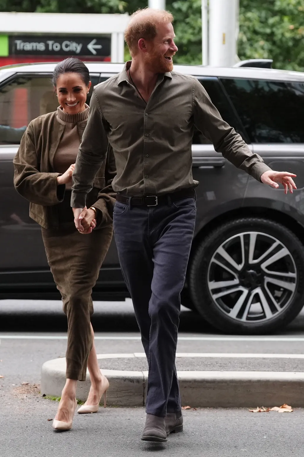 Image may contain Prince Harry Duke of Sussex Meghan Duchess of Sussex Body Part Hand Person Adult and Holding Hands