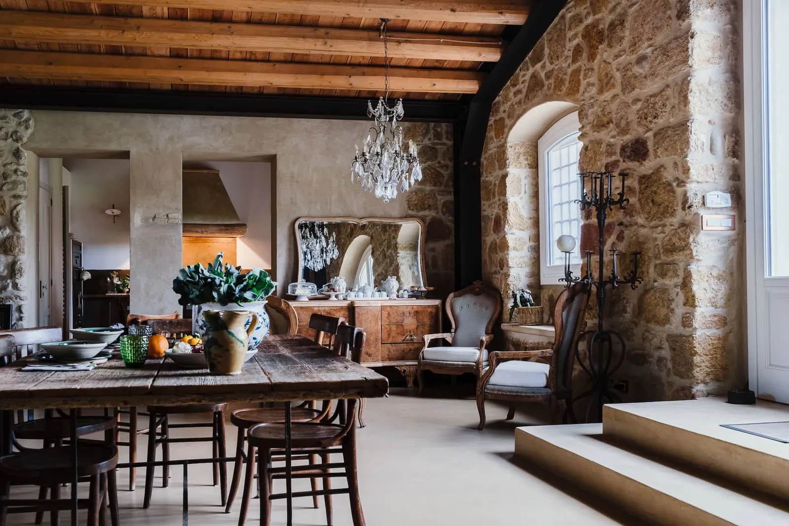 Image may contain Home Decor Chair Furniture Architecture Building Dining Room Dining Table Indoors Room and Table