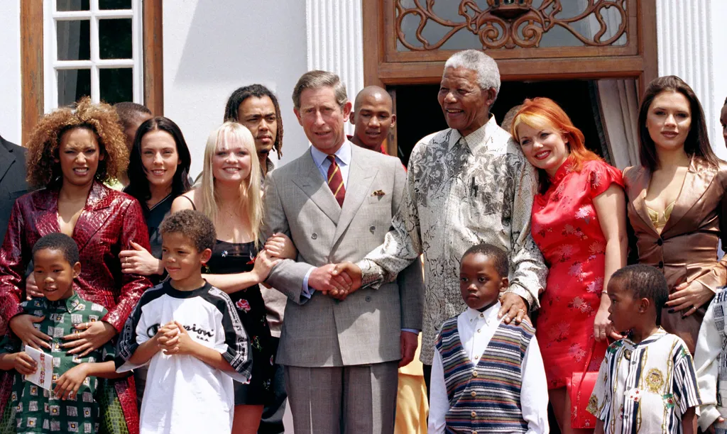 Image may contain Nelson Mandela Charles Prince of Wales Victoria Beckham Geri Halliwell and Melanie Brown. The Prince...