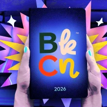 An illustration of a person holding a tablet that says BookCon