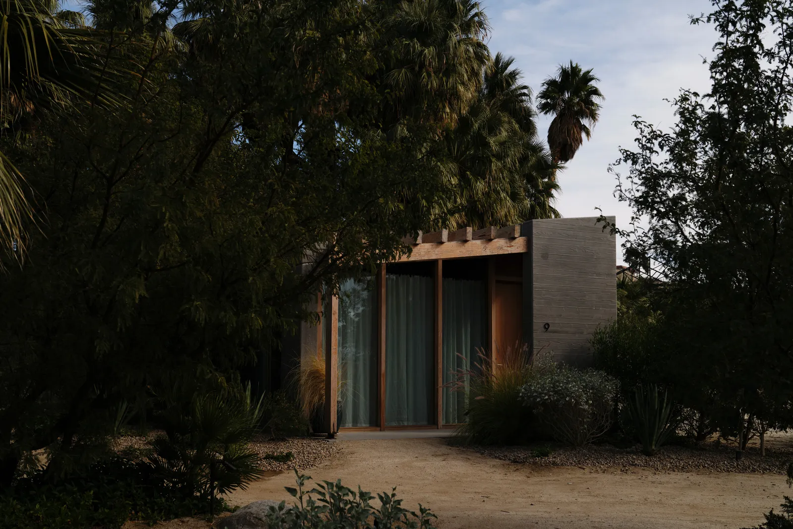 Image may contain Architecture Building House Housing Villa Plant Tree Vegetation Hotel Resort and Door