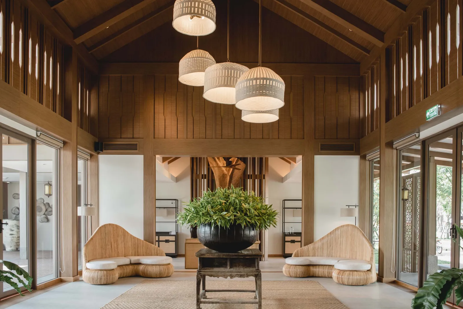 Image may contain Indoors Interior Design Plant Architecture Building Foyer Lamp Furniture Living Room and Room
