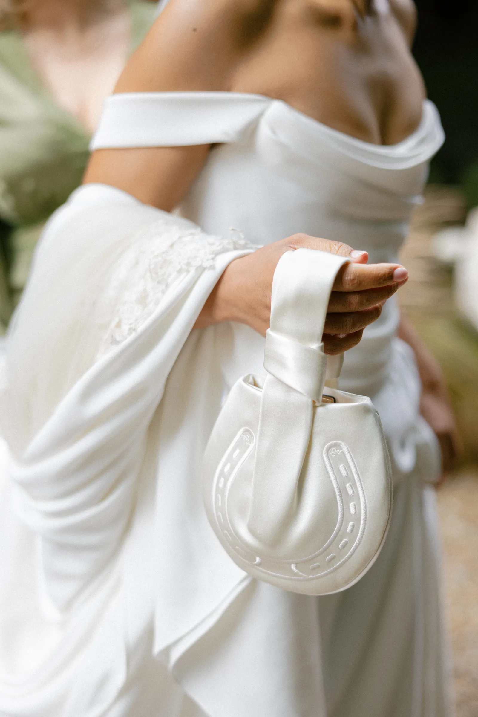 Image may contain Clothing Dress Fashion Formal Wear Gown Wedding Wedding Gown Adult Person Body Part and Finger