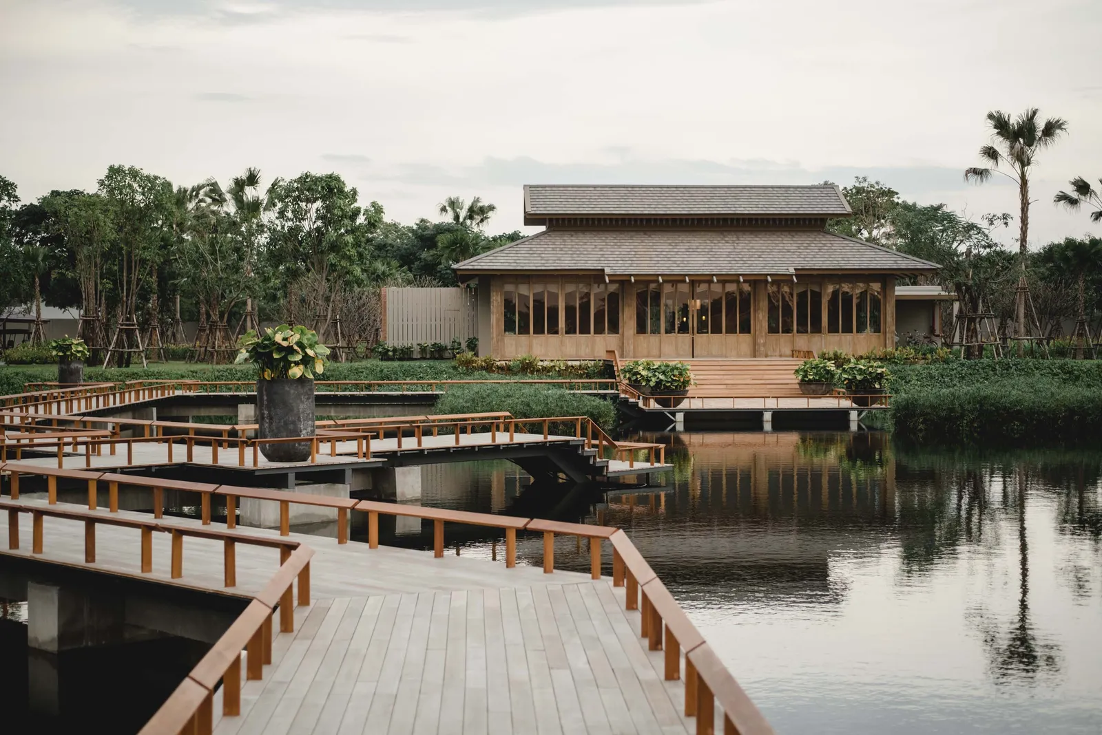 Image may contain Architecture Building Hotel Resort Nature Outdoors Scenery Plant Pool Water and Swimming Pool