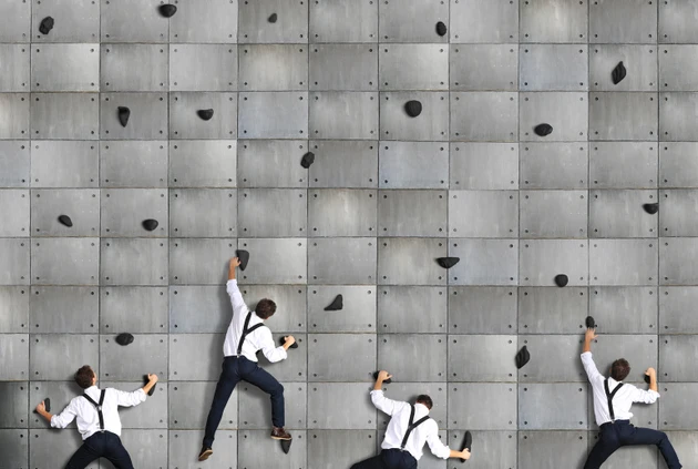 Business concept, a group of employees climbs up