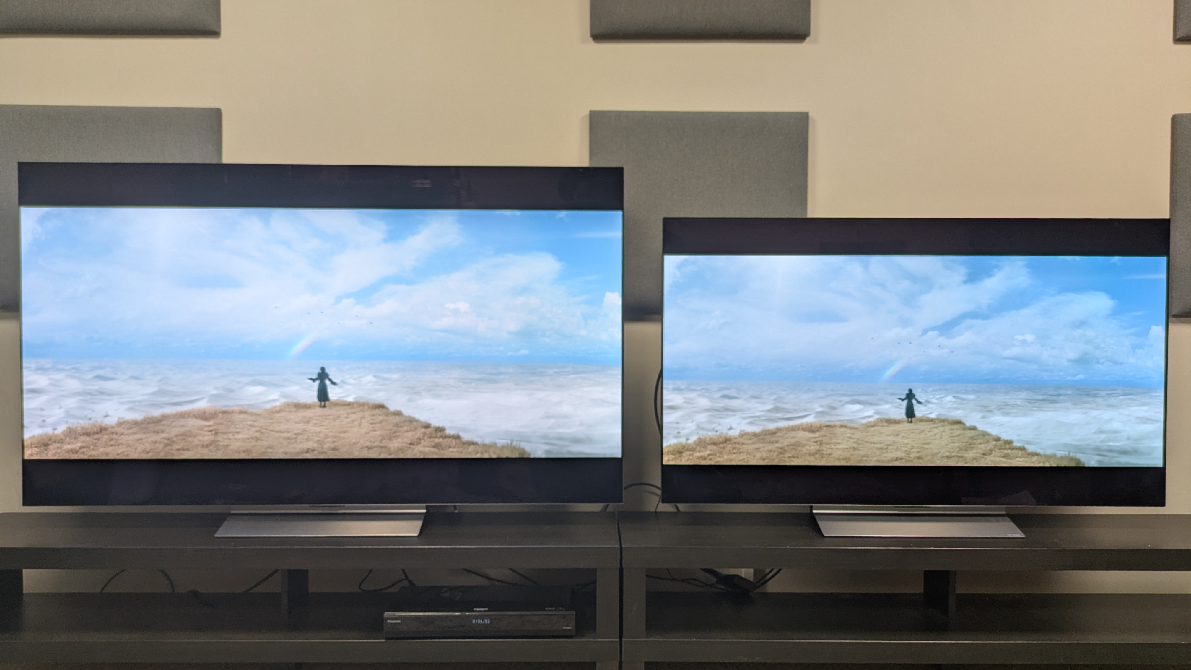 The LG C6 (left) and LG C5 (right) showing Elphaba standing on a cliffside from Wicked. The C6 shows higher brightness and better color accuracy compared to the C5.