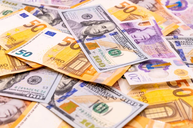 Money background with many British pound, US dollars and Euro banknotes