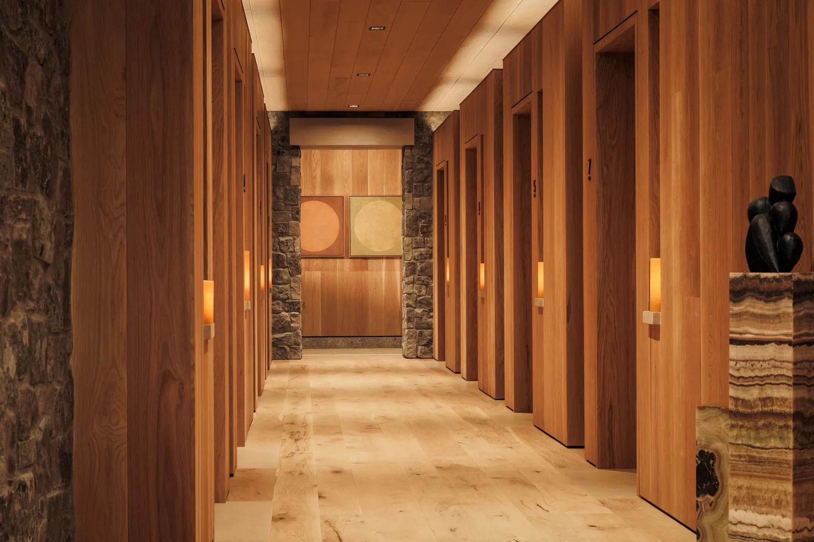 Image may contain Indoors Interior Design Wood Floor Wood Panels Hardwood Stained Wood and Lamp