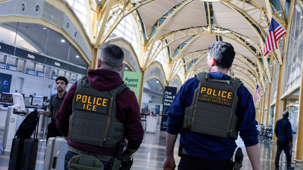 US Immigration and Customs Enforcement (ICE) agents patrol at Washington Reagan National Airport in Arlington, Virginia, US, March 24, 2026. US Immigration and Customs Enforcement (ICE) agents patrol at Washington Reagan National Airport in Arlington, Virginia, US, March 24, 2026.