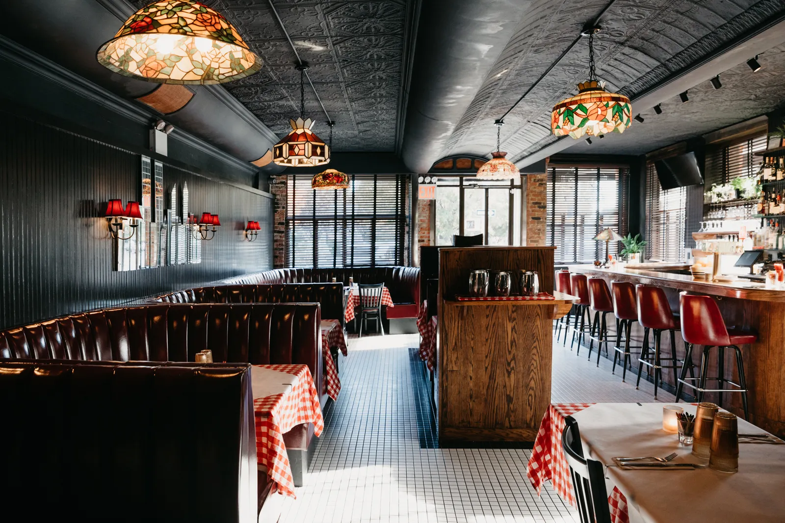 Image may contain Indoors Restaurant Chair Furniture Lamp and Bar