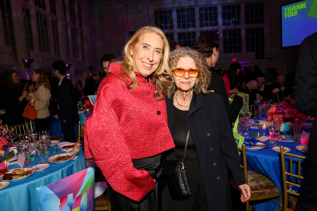 Image may contain Lisa Phillips Clothing Coat Jacket Person Photobombing Adult Accessories Sunglasses and Face