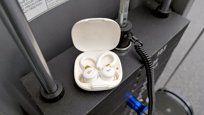 anker soundcore sport x20 earbuds sitting on weight rack