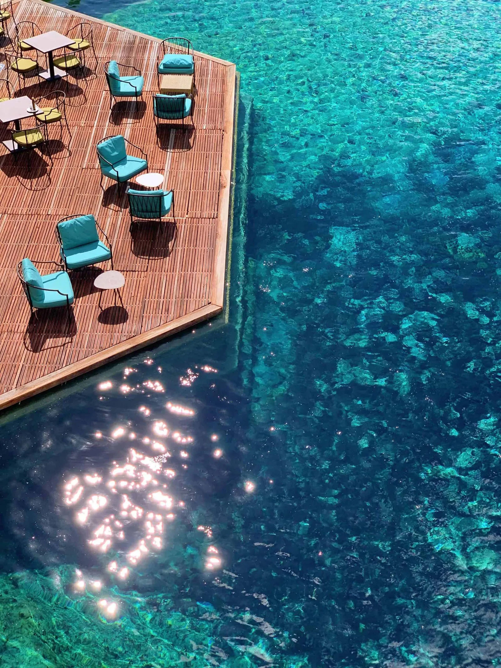 Image may contain Pool Water Swimming Pool Outdoors Nature Sea Chair Furniture Aerial View Coast and Shoreline