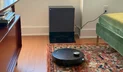 Dreame X60 Max Ultra Complete robot vacuum cleaning rug in front of self-empty dock