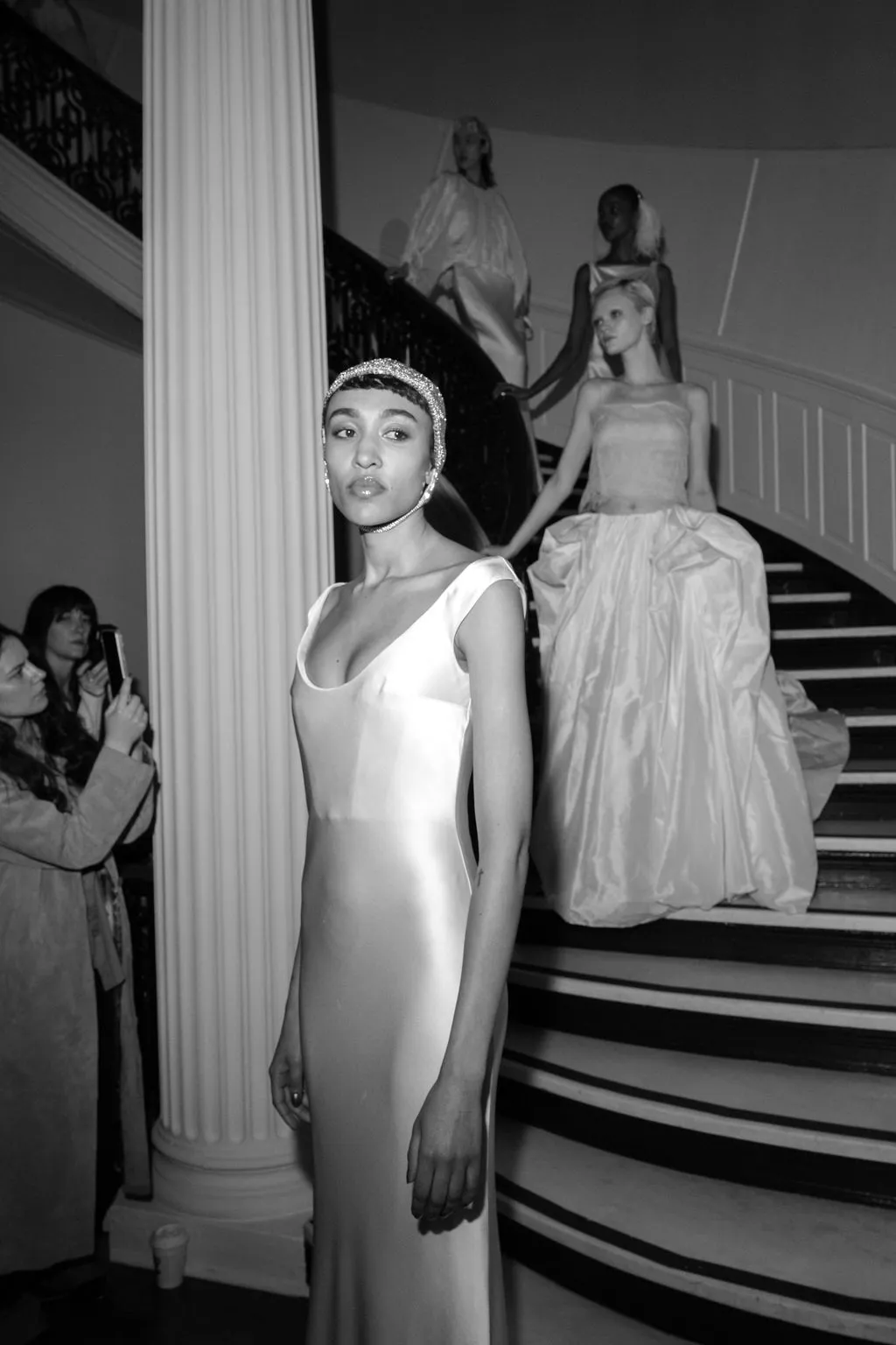 Image may contain Architecture Building House Housing Staircase Clothing Dress Formal Wear Handrail and Fashion