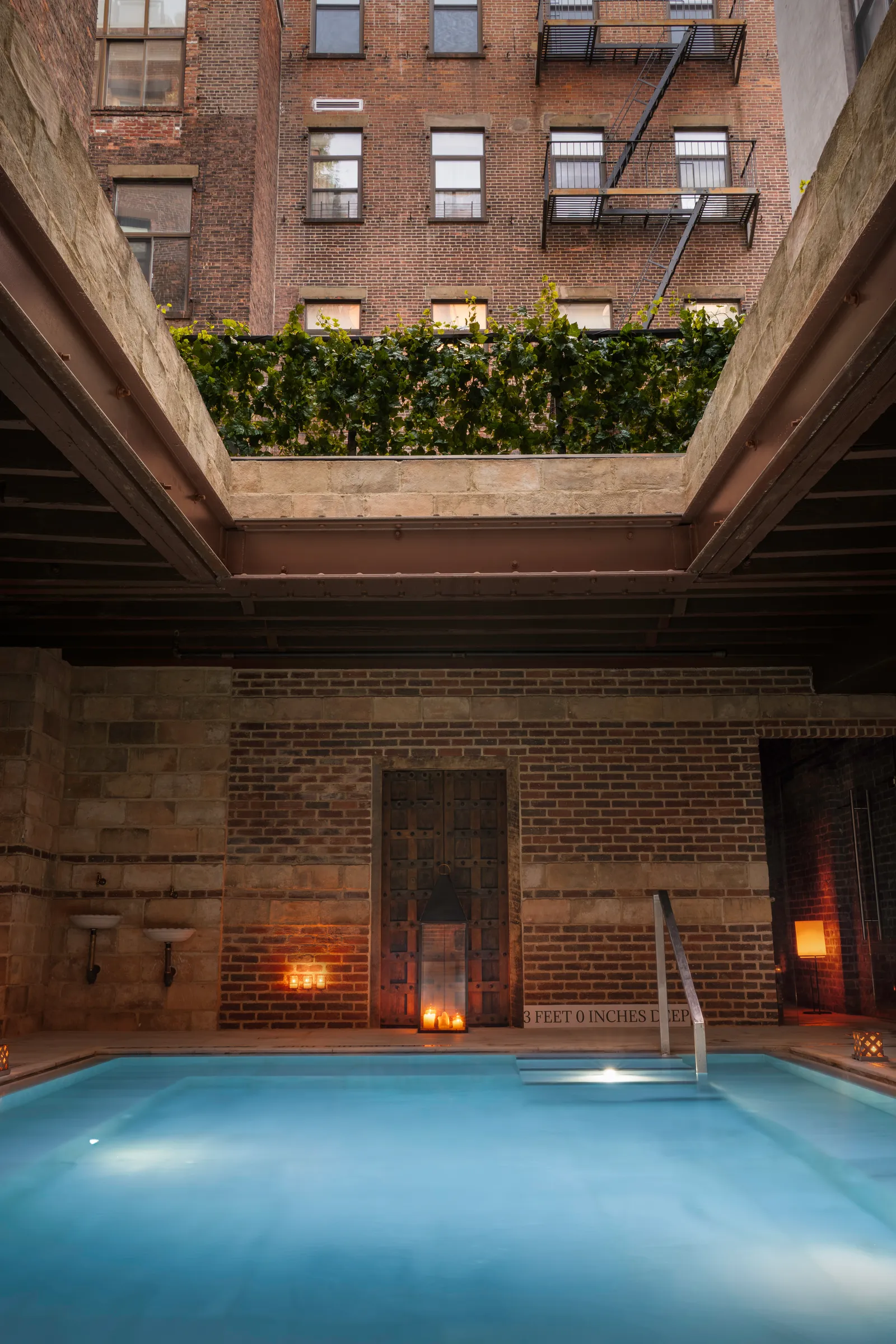Image may contain Pool Water City Swimming Pool Urban Architecture Building High Rise Hotel and Apartment Building