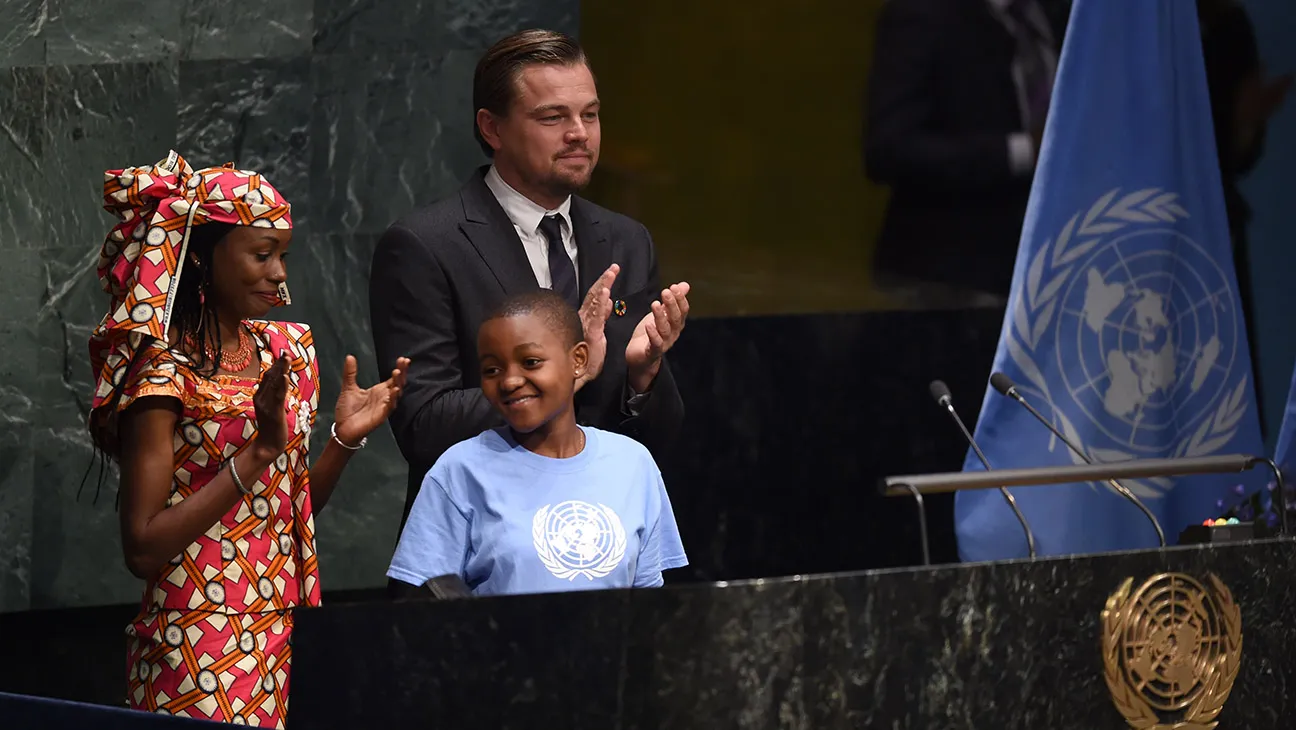 Hindou Oumarou Ibrahim, Coordinator of the Indigenous Women and Peoples Association of Chad, Getrude Clement(C), Youth Representative from Tanzania, and Leonardo DiCaprio, actor and UN Messenger of Peace attend the high level signature ceremony for the Paris Agreement at the United Nations General Assembly Hall April 22, 2016 in New York.