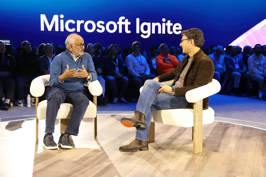 Adobe CEO Shantanu Narayen (L) and Judson Althoff, CEO of Microsoft's commercial business