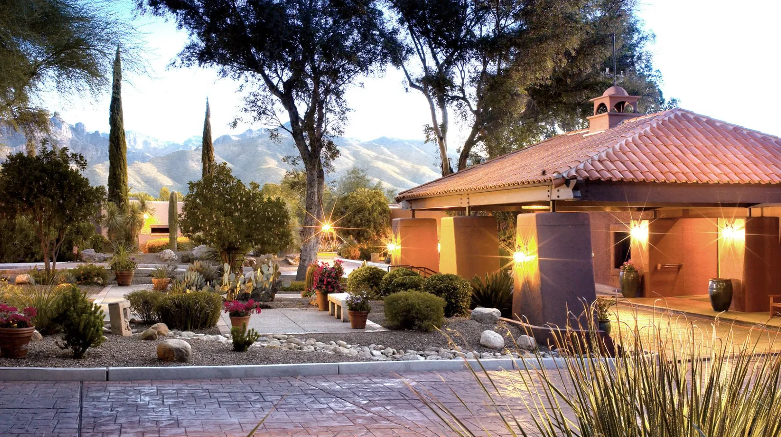 Image may contain Path Walkway Flagstone Architecture Building House Housing Villa Flare Light Road and Plant