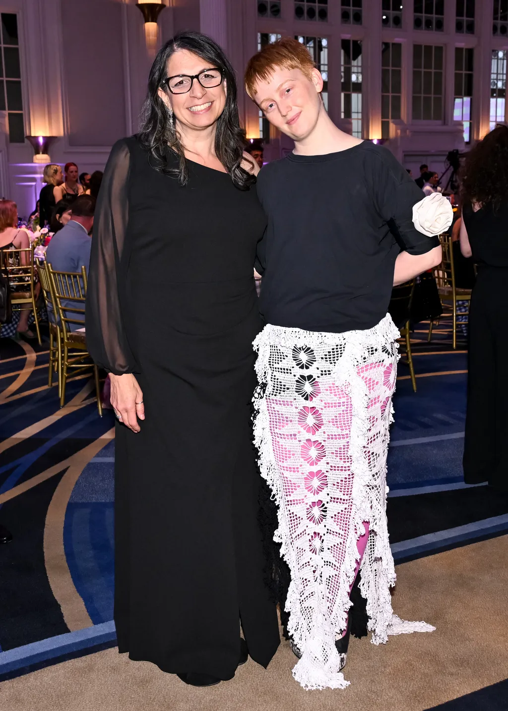 Image may contain Fashion Clothing Dress Pants Urban Person Adult Skirt Face Head Photography and Portrait