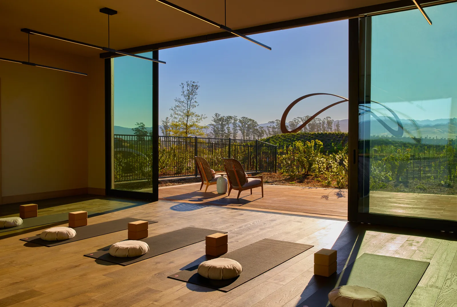Image may contain Indoors Interior Design Chair Furniture Home Decor Rug Floor Architecture Building and Foyer