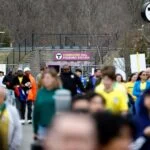 Fans walk from the Foxboro Commuter Rail station towards Gillette Stadium before the international friendly between Brazil and France on March 26.