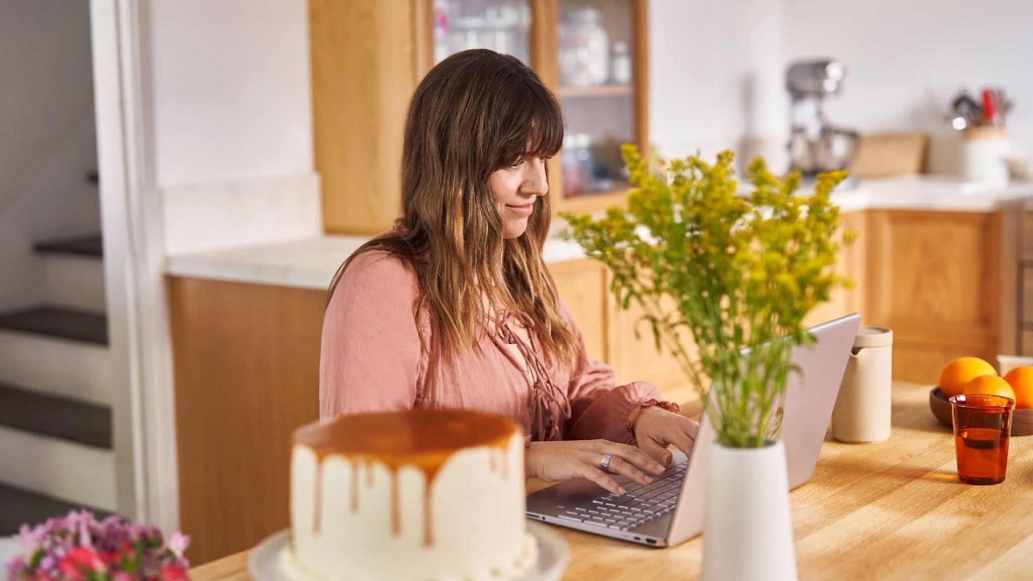 A happy person using a Windows 11 laptop