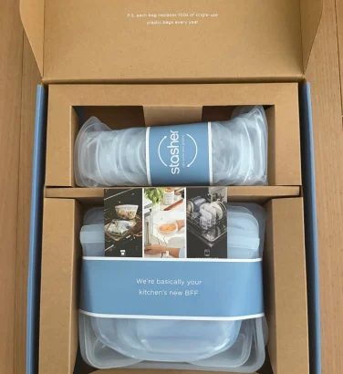 Cardboard box with Stasher reusable silicone bags adn bowl wraps inside