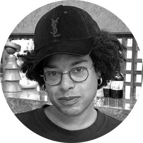 Image may contain Baseball Cap Cap Clothing Hat Face Head Person Photography Portrait Accessories and Glasses
