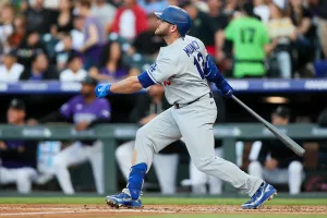 DENVER, CO - APRIL 20: Max Muncy #13 of the Los Angeles Dodgers hits a solo home run in the second inning against the Colorado Rockies at Coors Field on April 20, 2026 in Denver, Colorado. (Photo by Justin Edmonds/Getty Images)