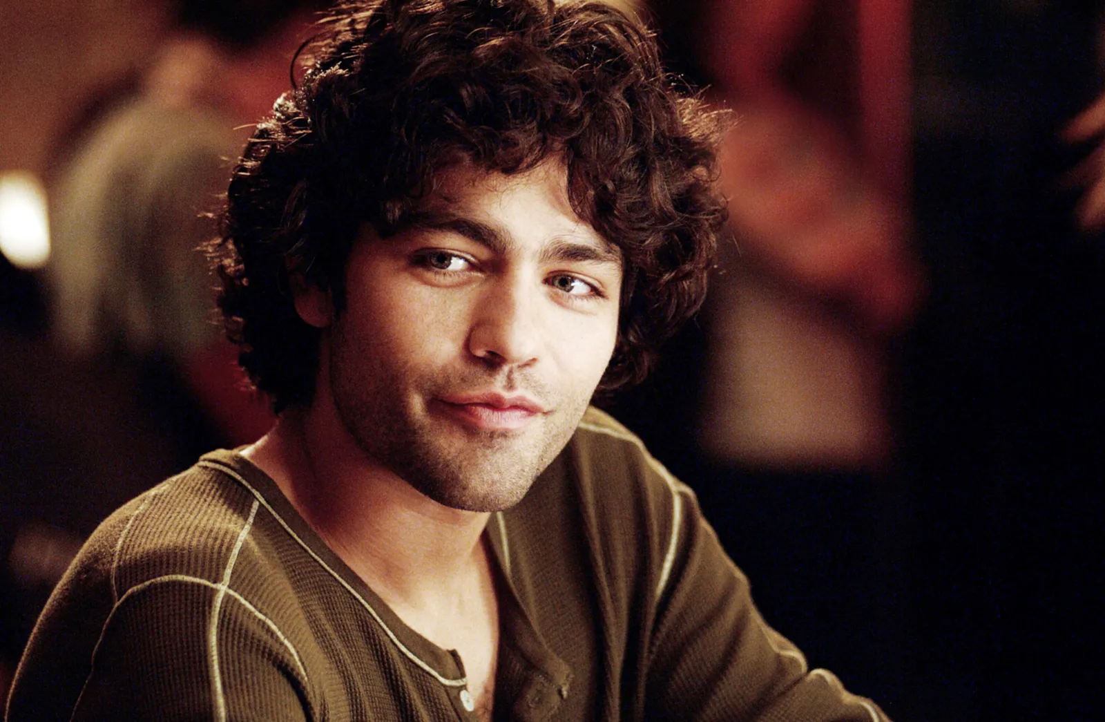 Image may contain Adrian Grenier Head Person Face Photography Portrait Happy Smile Dimples Adult and Body Part
