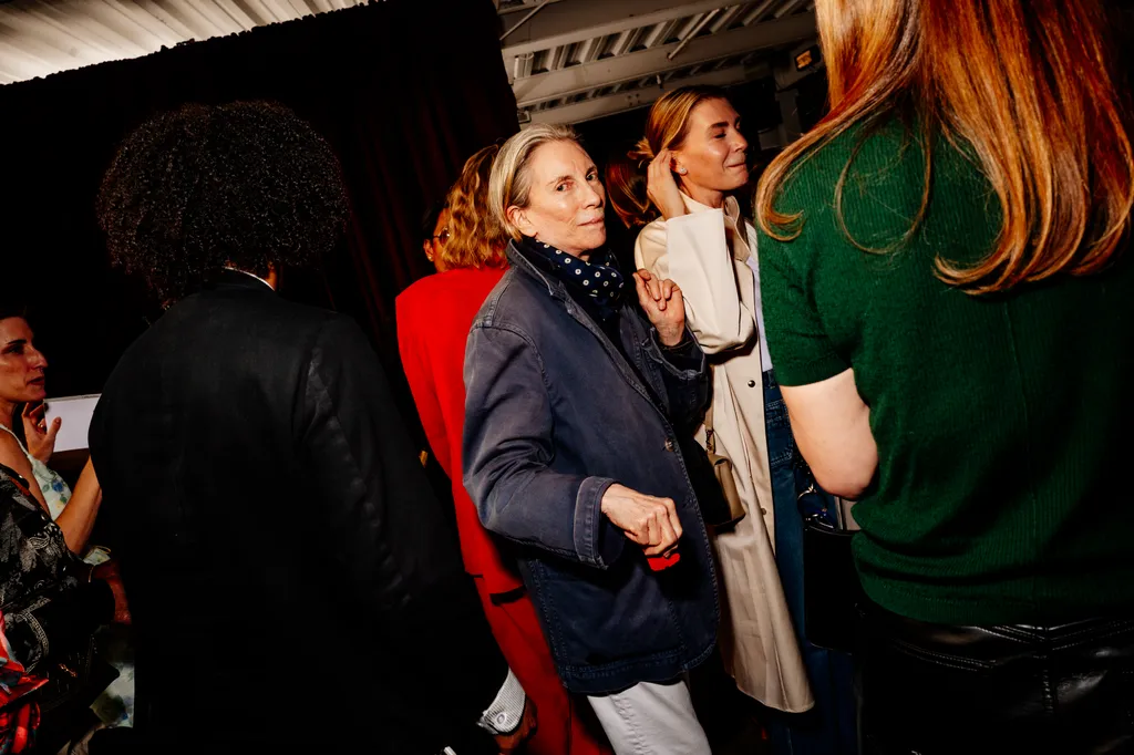 Image may contain Clothing Coat Jacket Adult Person Photobombing Face Head and Fashion