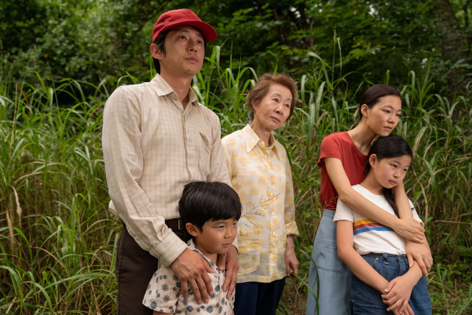Image may contain Steven Yeun Seishiro Kato Yoon Yeojeong People Person Family Adult Face Head and Plant