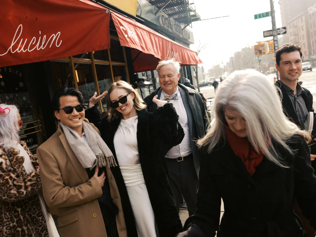 Image may contain Clothing Coat Jacket Blazer Face Head Person Photography Portrait Formal Wear Suit and People