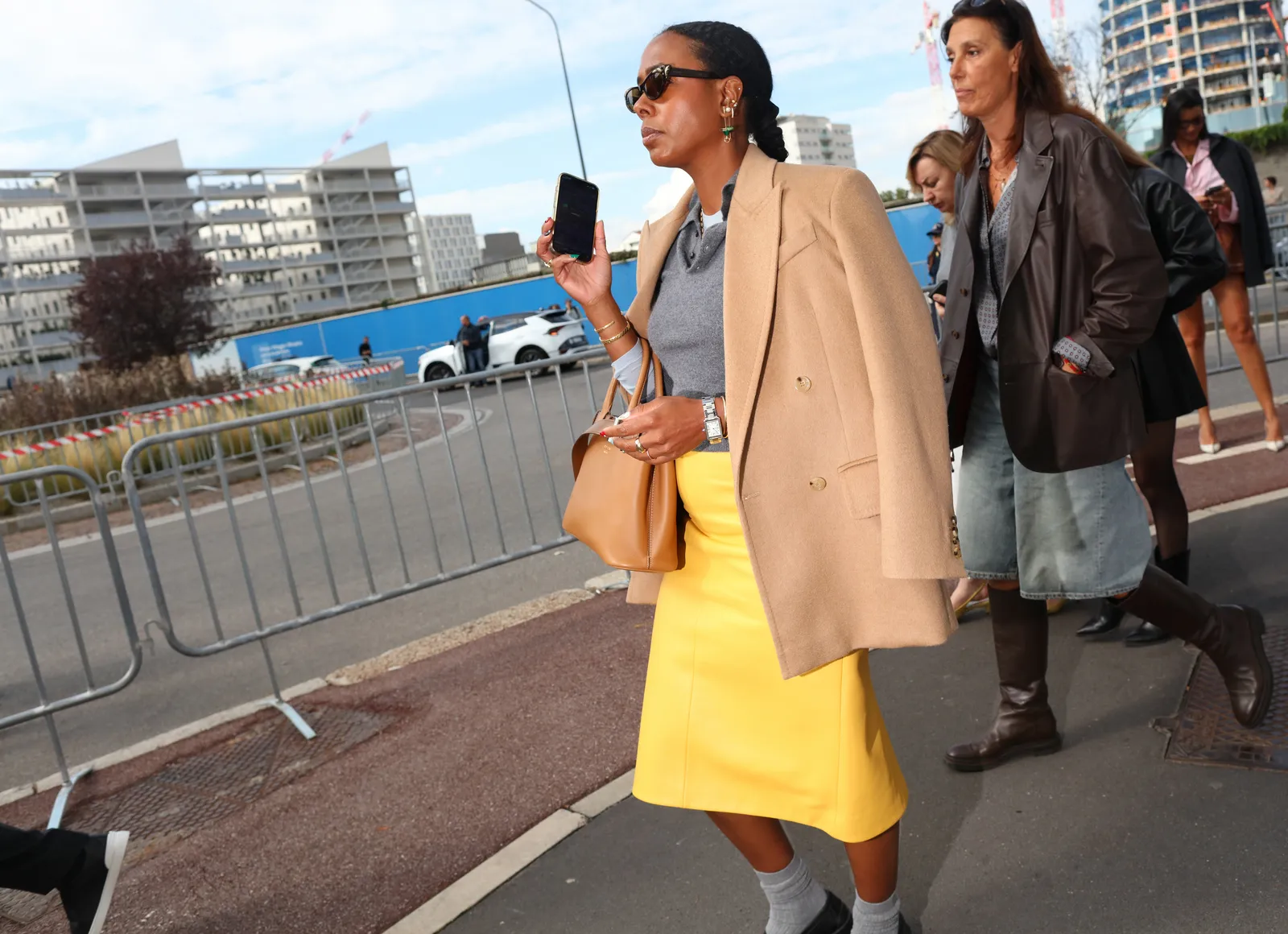 Vanity Fairs Nicole Chapoteau wears a Prada bag and skirt. Milan spring 2026 readytowear