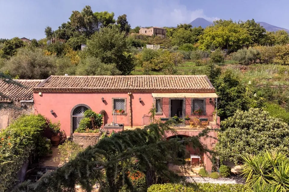 Image may contain Architecture Building House Housing Villa Outdoors Hacienda Nature Countryside Plant and Rural