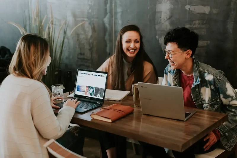 A group collaborating in a classroom setting; the exact scenario where random selection beats raised hands
