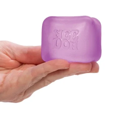 needoh nice cube sitting in someone's hand
