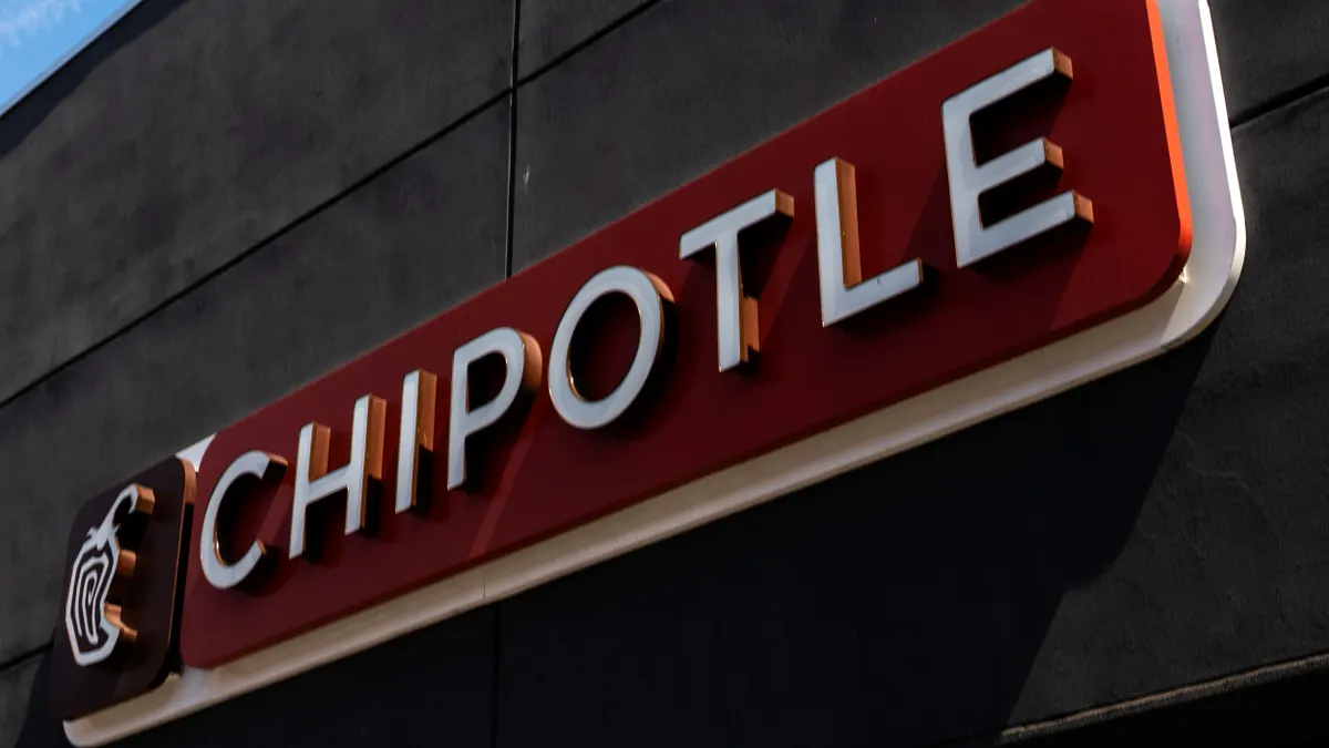 A sign on a Chipotle restaurant.
