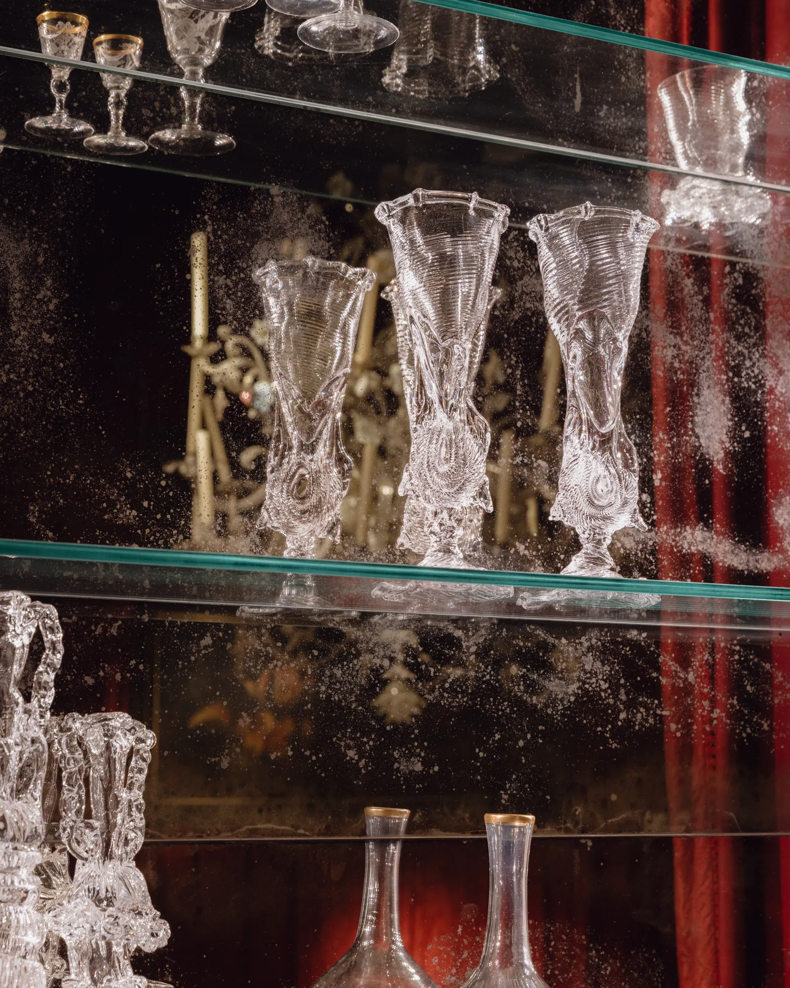 Image may contain Glass Furniture Cabinet Jar Pottery Vase Adult Person Wedding and Goblet